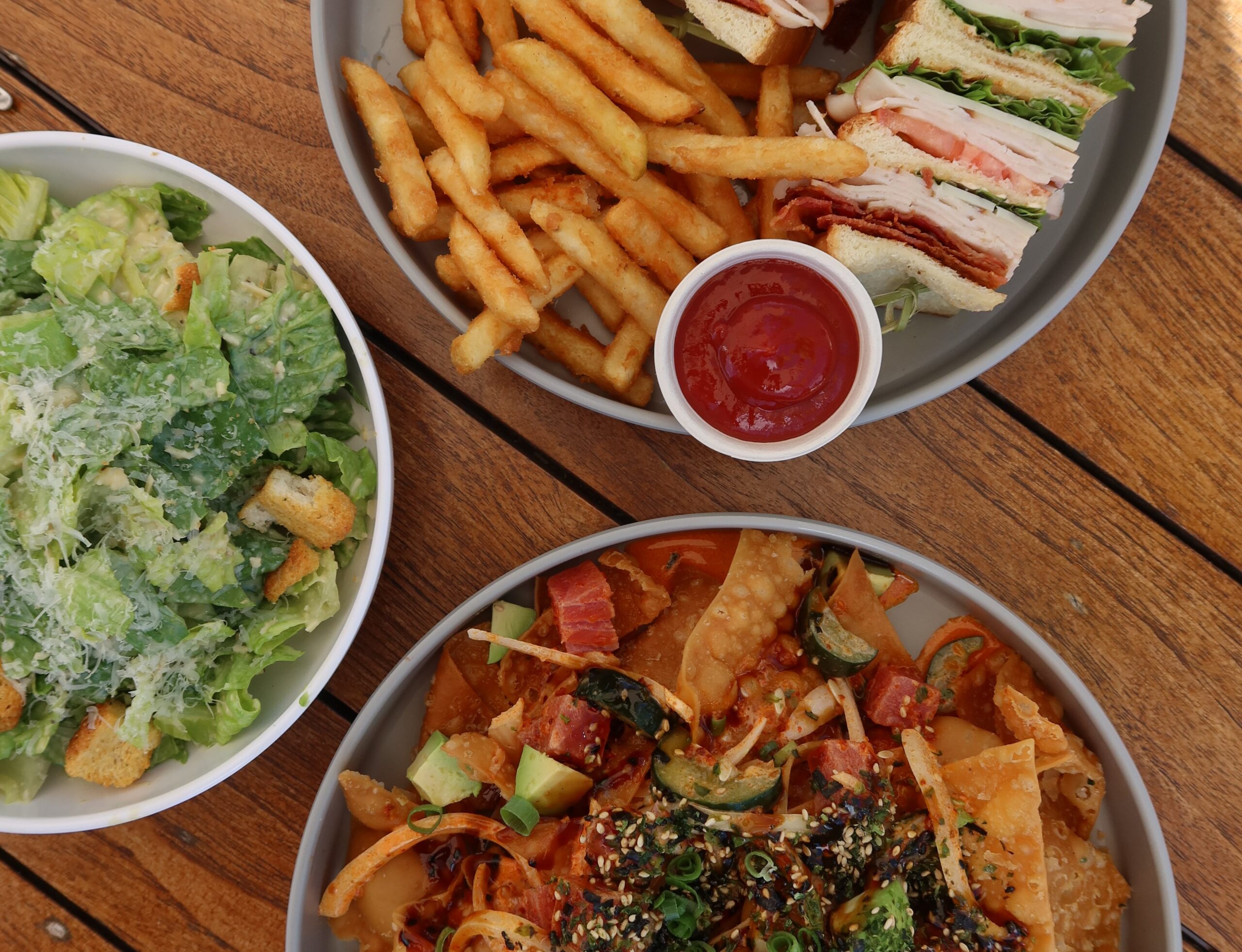 caesar salad, club sandwich. poke nachos